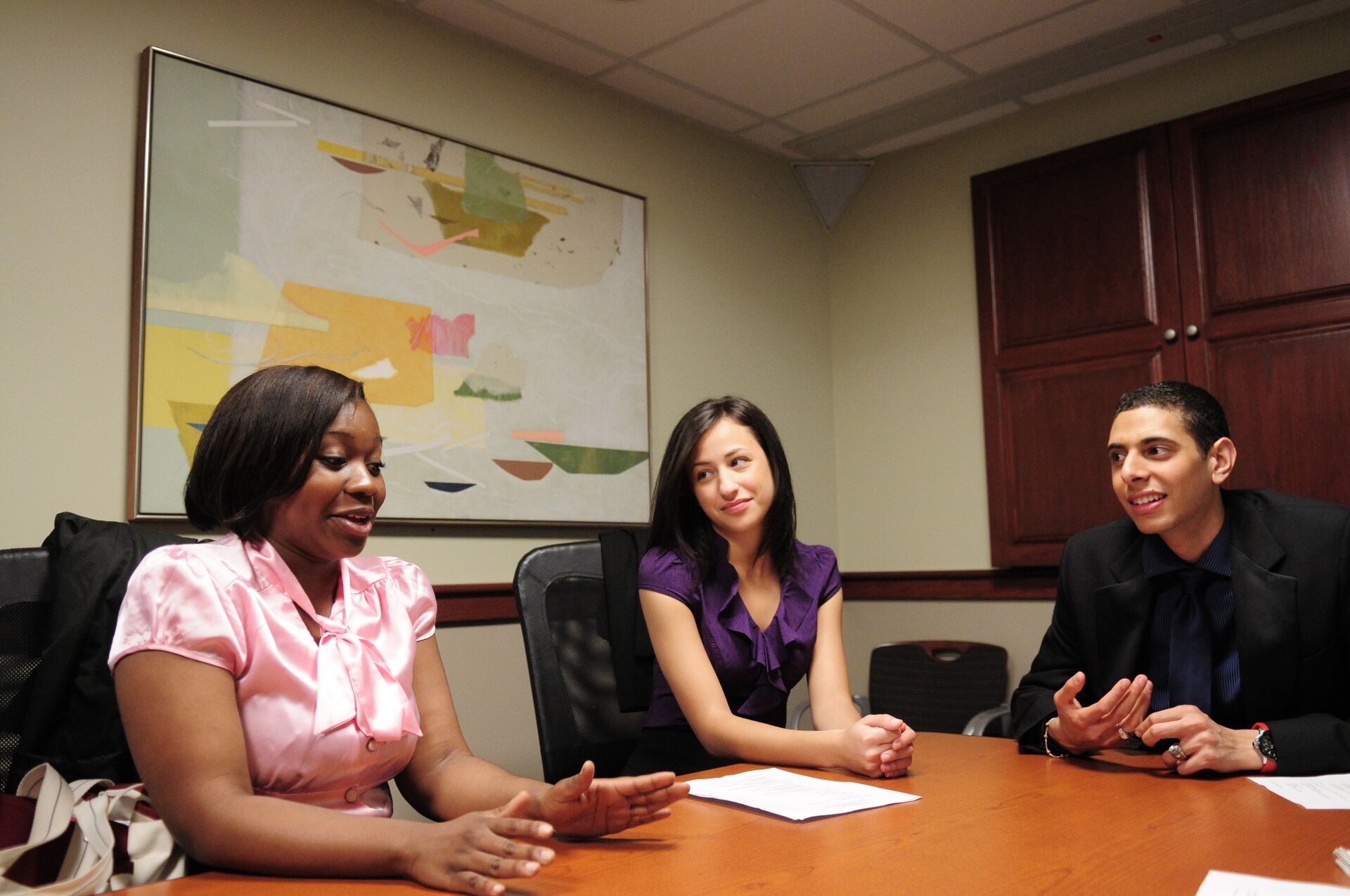 Students sitting in a board room