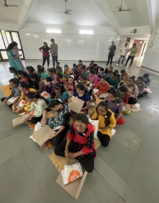 Blind female students in Andh Kanya Shala with their braille booklets and Project Stree menstrual hygiene bags