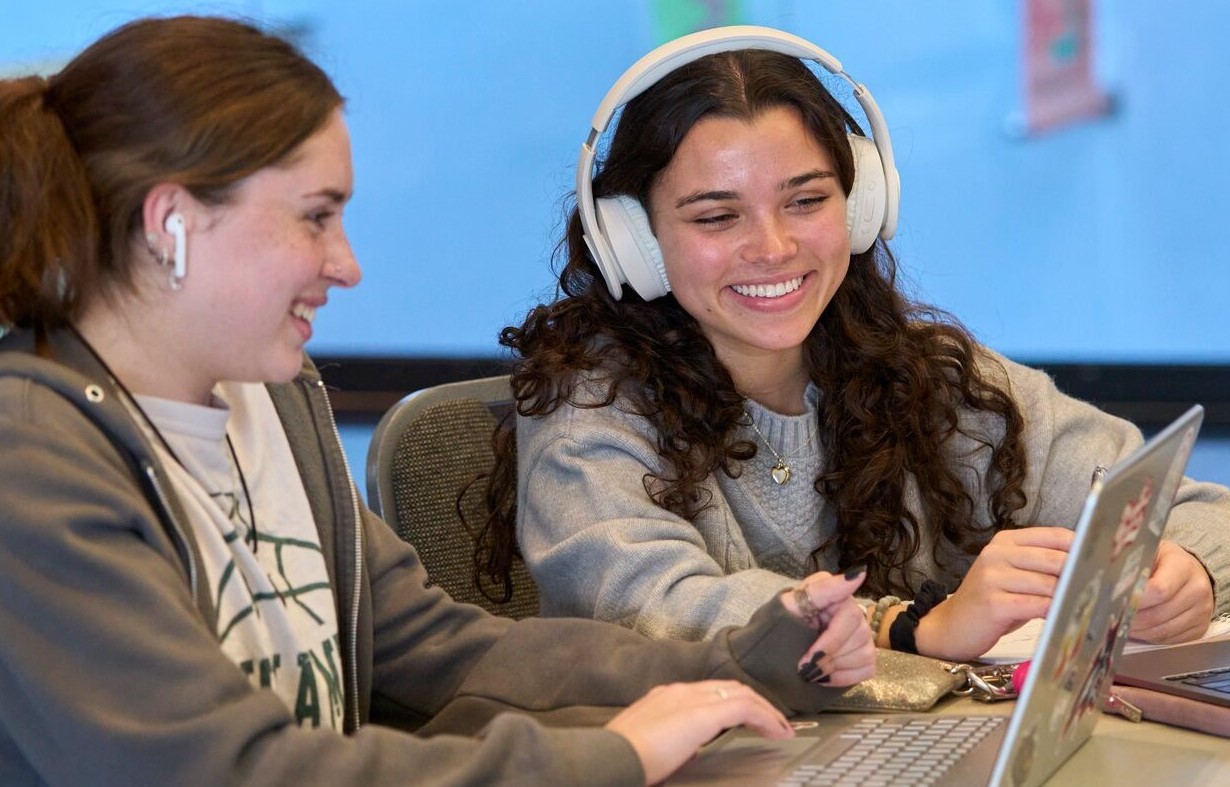 two students with laptop