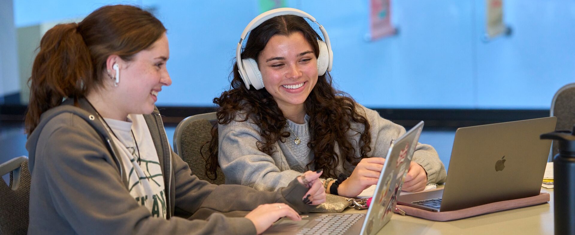 two students with laptop