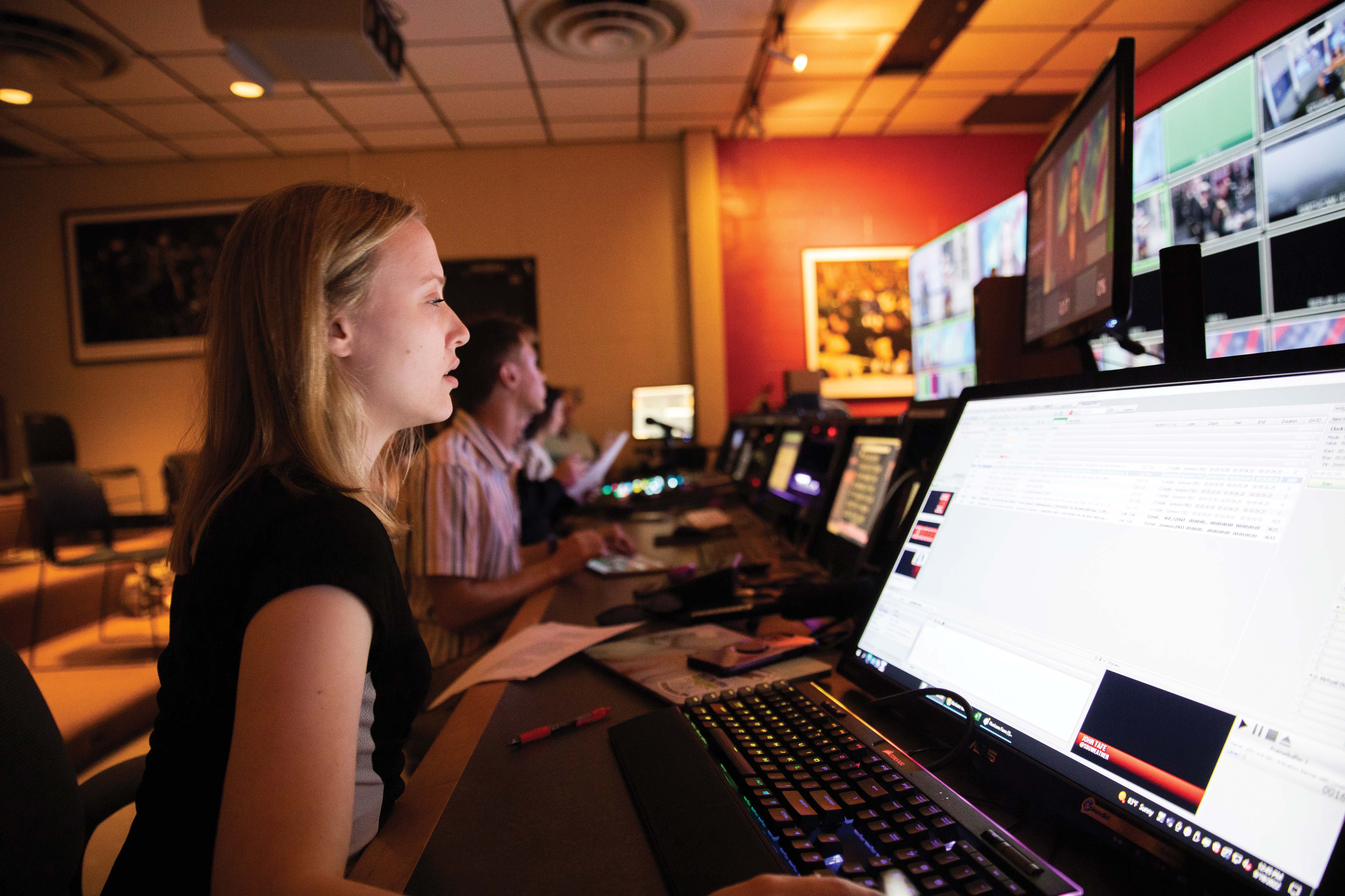 female student in the production studio control room