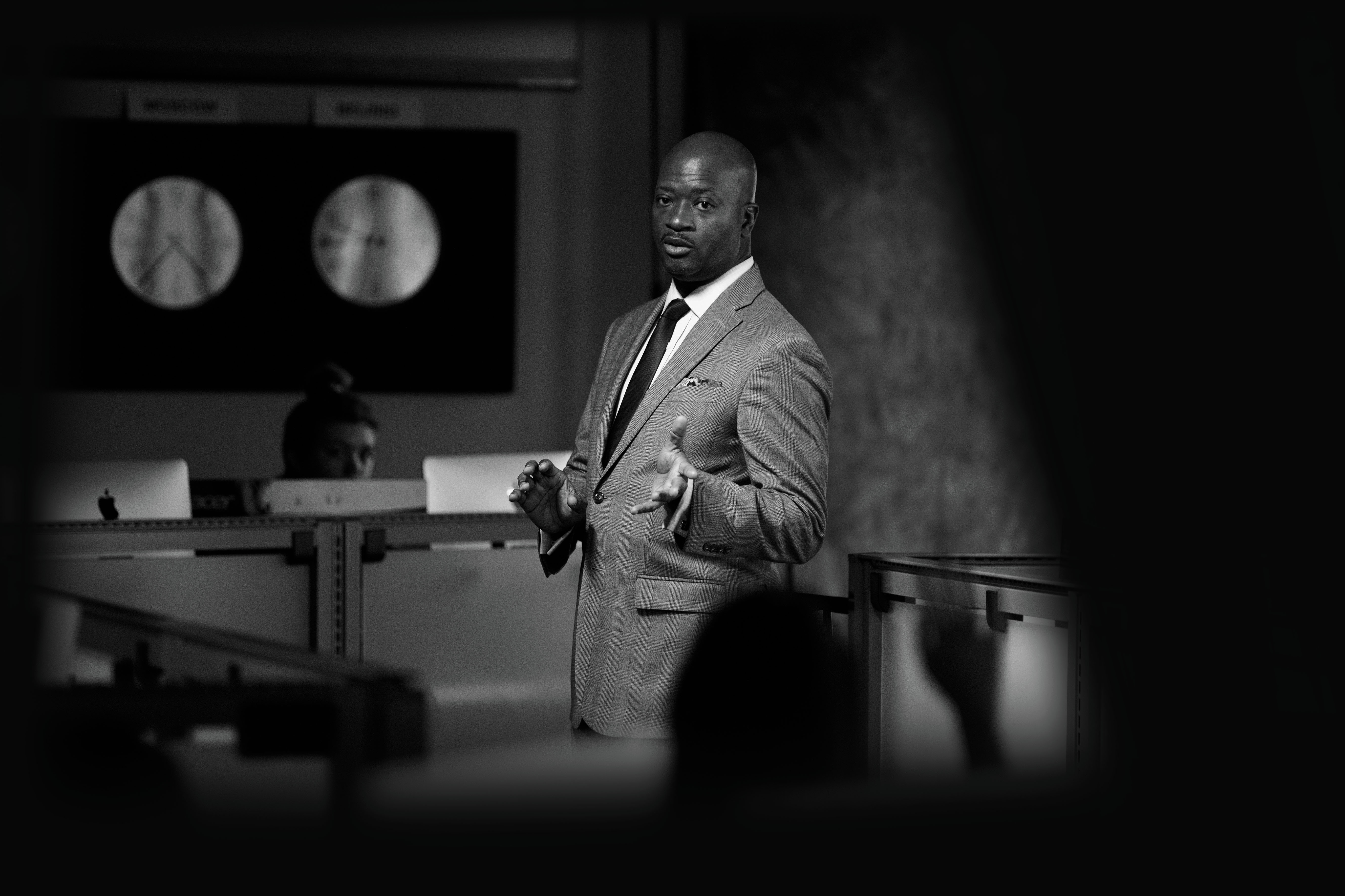 faculty member lectures in a computer lab 