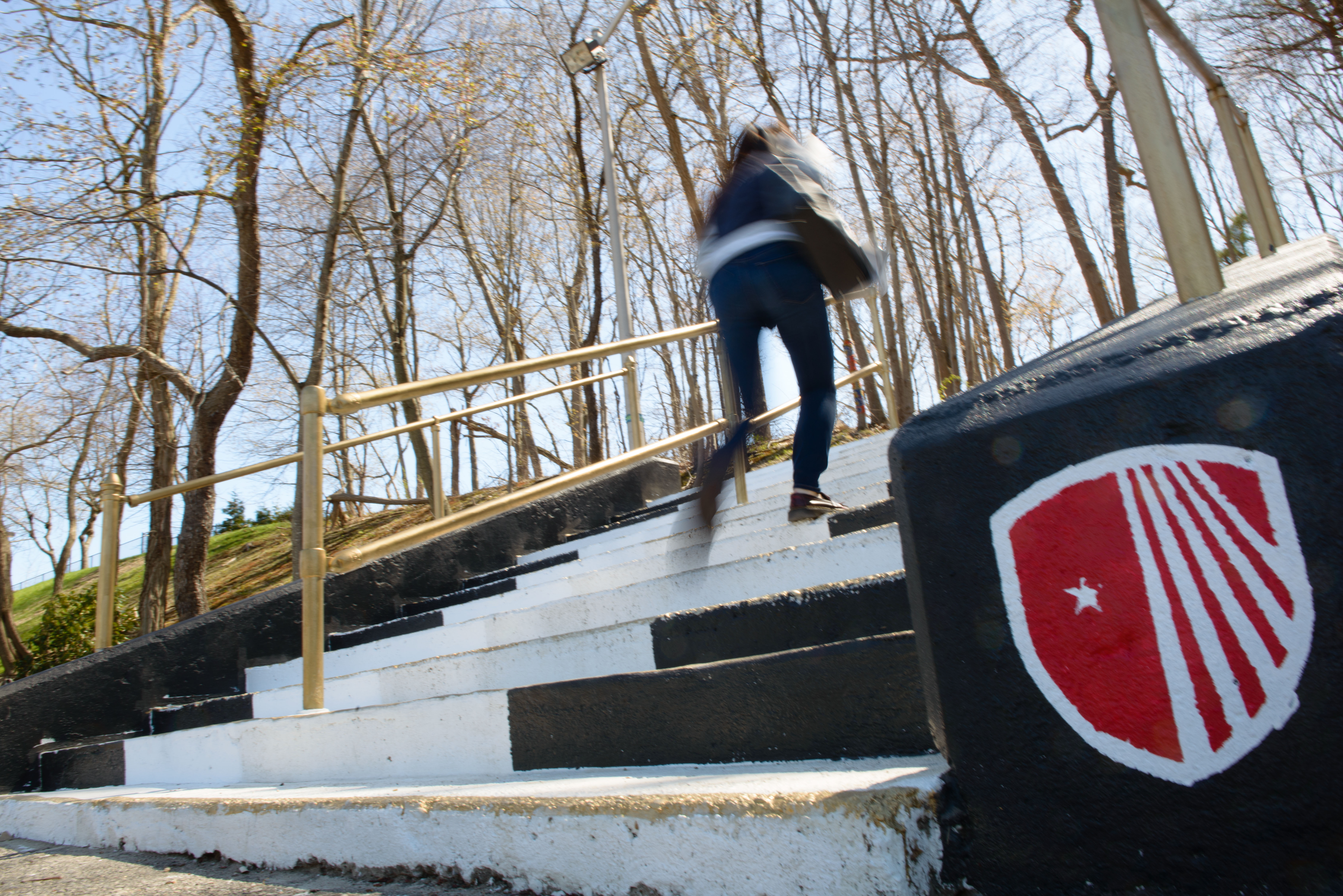 image of someone walking up a set of stairs